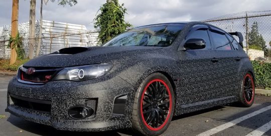 Subaru wrapped in 3M 1080 Shadow Black vinyl