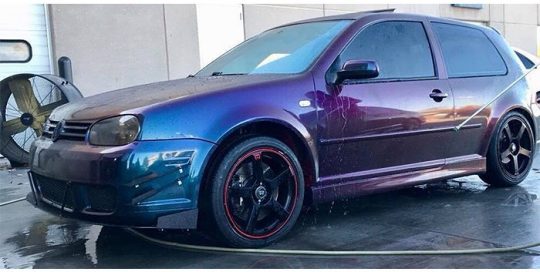 Volvo Golf wrapped in 3M ColorFlip Gloss Deep Space Blue/Bronze/Purple shade shifting vinyl