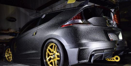 Honda Crz wrapped in Orafol 975 Textured Black Honeycomb and Arlon Gold Chrome vinyls