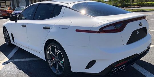 Kia Stinger wrapped in 3M 1080 White Carbon Fiber vinyl