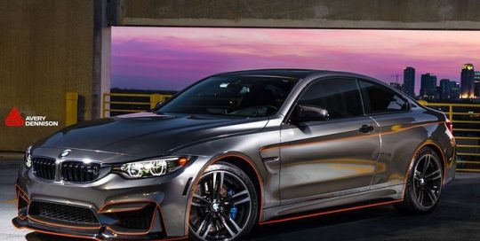 Bmw M4 wrapped in Avery SW Black Chrome and 1200 Reflective Orange vinyls