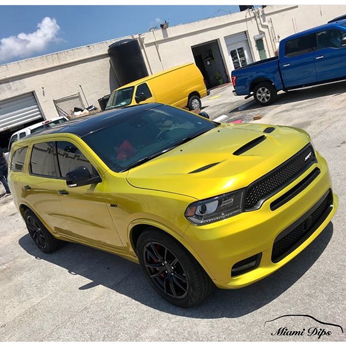 Dodge durango wrapped in 3M 1080 Gloss Lemon Sting Vinyl Vinyl Wrap