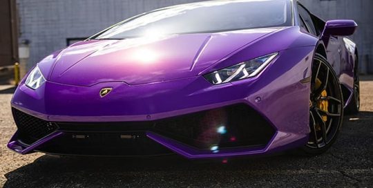 Lamborghini Huracan wrapped in 3M 1080 Gloss Plum Explosion vinyl