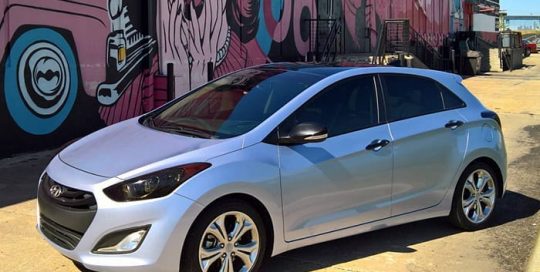 Hyundai Elantra wrapped in Avery SW Gloss Quick Silver Metallic vinyl
