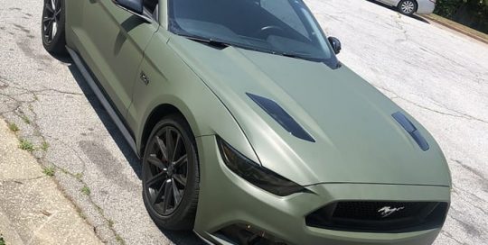 Ford Mustang wrapped in 3M 1080 Matte Military Green vinyl