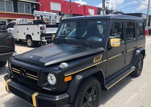 Mercedes Benz Gwagon wrapped in 3M Satin Black and Avery SW Gold Chrome vinyl