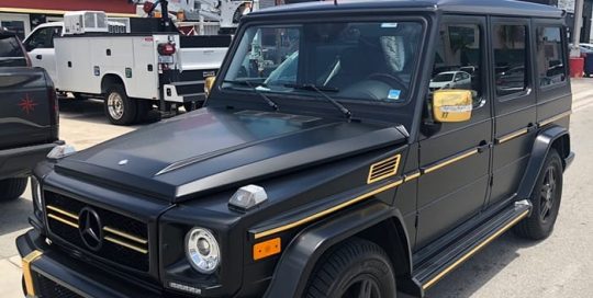 Mercedes Benz Gwagon wrapped in 3M Satin Black and Avery SW Gold Chrome vinyl