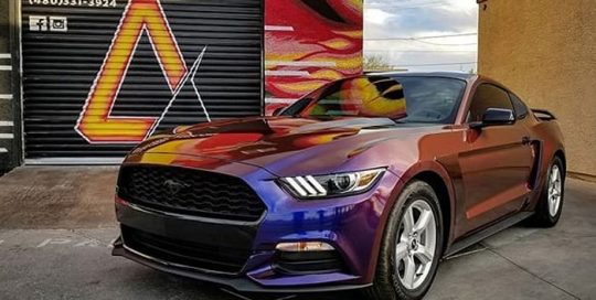 Ford Mustang wrapped in Avery ColorFlow Gloss Roaring Thunder Blue/Red shade shifting vinyl