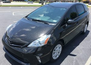 Toyota Prius wrapped in 3M 1080 Gloss Galaxy Black vinyl