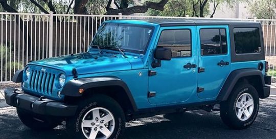 Jeep wrangler wrapped in 3M 1080 Gloss Atomic Teal vinyl