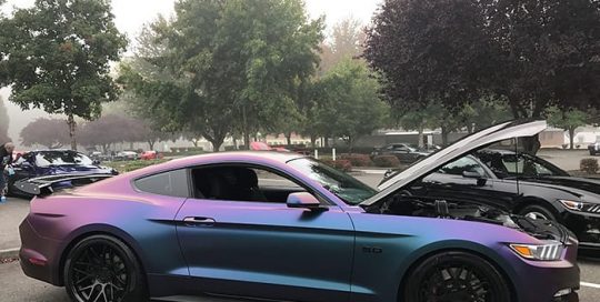 Ford Mustang wrapped in Avery ColorFlow Satin Rushing Riptide Cyan/Purple shade shifting vinyl