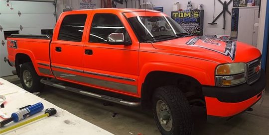 Gmc Sierra wrapped in 3M Neon Fluorescent Orange vinyl