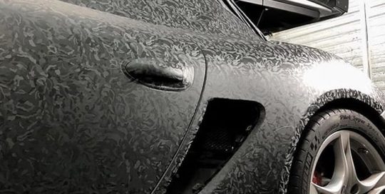Porsche Cayman wrapped in 3M 1080 Shadow Black vinyl