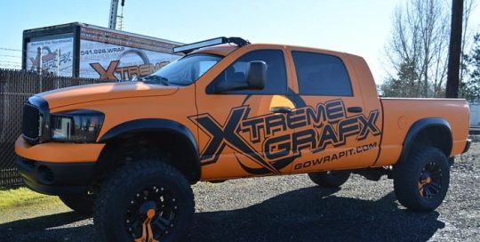 Dodge wrapped in 3M 1080 Matte Orange vinyl