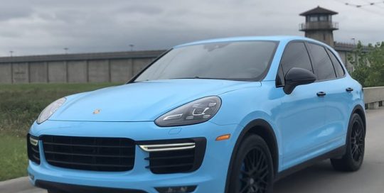 Porsche Cayenne wrapped in 3M 1080 Gloss Sky Blue vinyl