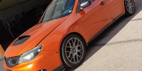 Subaru wrapped in 3M 1080 Gloss Fiery Orange vinyl