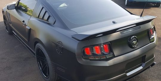 Ford Mustang wrapped in 3M Satin Black vinyl