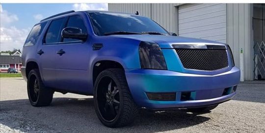 Cadillac Escalade wrapped in Orafol 970RA Matte Ultra Marine Violet shade shifting vinyl