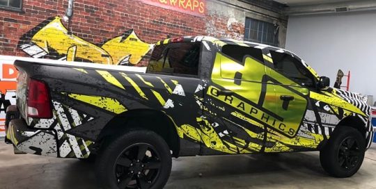 Dodge Ram wrapped in printed Avery 1105ezrs vinyl with 1380z Matte overlaminate and Avery Silver Chrome laminated with Orafol 8300 Brimstone Yellow