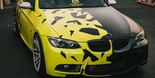 Bmw 335i wrapped in Avery SW Gloss Ambulance Yellow and Satin Black vinyls