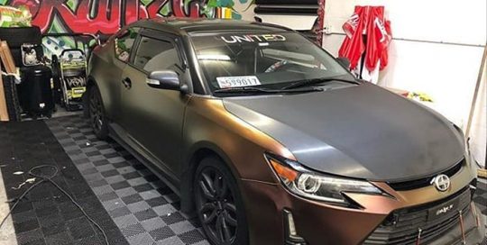 Scion TC wrapped in Avery ColorFlow Satin Rising Sun Red/Gold shade shifting vinyl