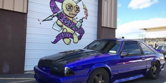 Ford Mustang wrapped in 3M 1080 Gloss Blue Raspberry vinyl