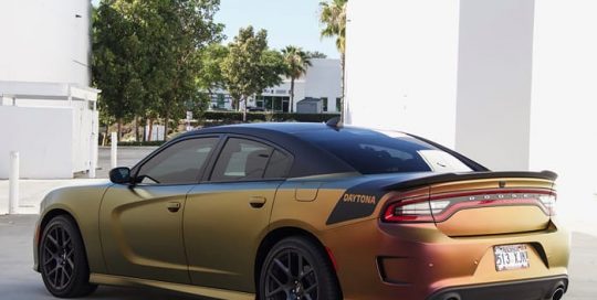 Dodge wrapped in Avery ColorFlow Satin Rising Sun Red/Gold shade shifting vinyl