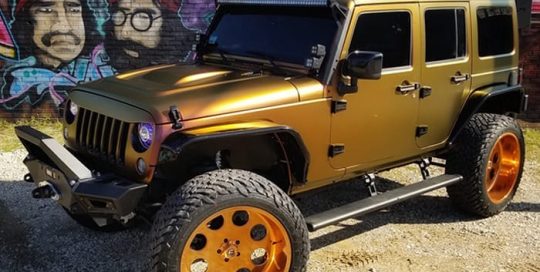 Jeep Wrangler wrapped in Avery ColorFlow Satin Rising Sun Red/Gold shade shifting vinyl