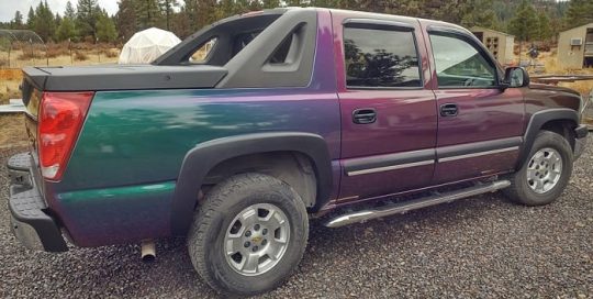 Chevrolet Avanlanche wrapped in Avery ColorFlow Gloss Lightning Ridge Green/Purple shade shifting vinyl