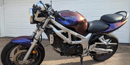 Suzuki Motorcycle wrapped in Avery ColorFlow Gloss Roaring Thunder Blue/Red shade shifting vinyl