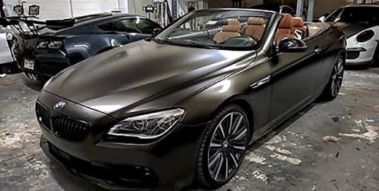 Bmw 650i wrapped in 3M 1080 Satin Gold Dust Black vinyl