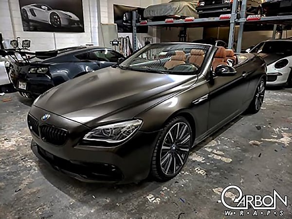 Bmw 650i wrapped in 3M 1080 Satin Gold Dust Black vinyl