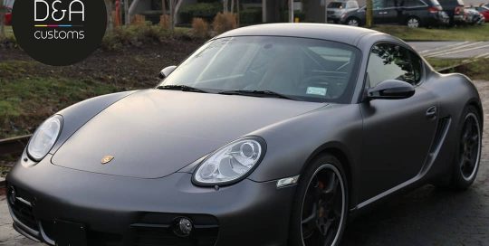 Porsche Cayman wrapped in 3M 1080 Satin Dark Gray vinyl
