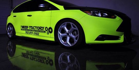 Ford Focus wrapped in Hi Liter (fluorescent) Yellow vinyl