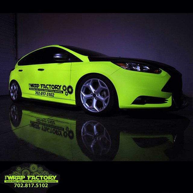 Ford Focus wrapped in Hi Liter (fluorescent) Yellow vinyl