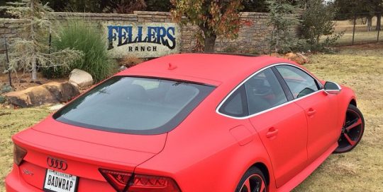 Audi RS7 wrapped in UPP F1 Matte Racing Red vinyl