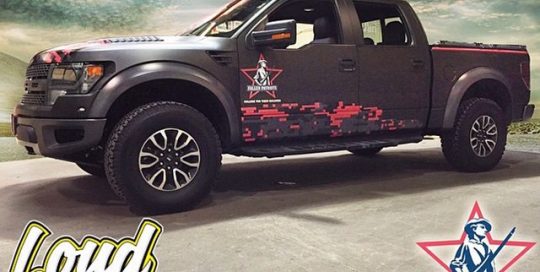 Ford Raptor wrapped in Matte Black vinyl and custom printing on IJ 480Cv3