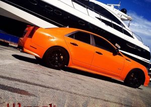 Cadillac CTVS wrapped in 970RA Municipal Orange vinyl