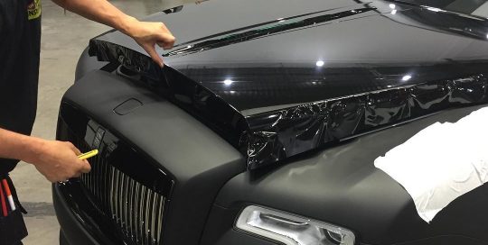 Rolls Royce Ghost wrapped in Gloss Black vinyl
