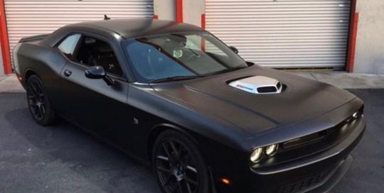 Dodge Challenger wrapped in Satin Black vinyl