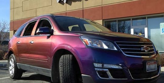 Chevrolet Traverse wrapped in Avery ColorFlow Gloss Rushing Riptide Cyan/Purple shade shifting vinyl