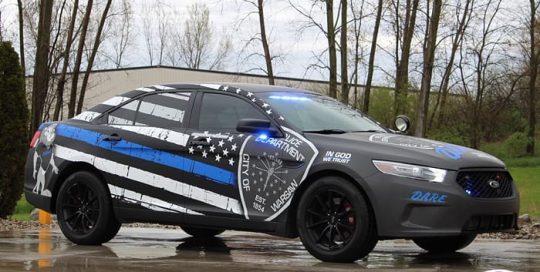 Ford wrapped in custom printed Avery 1105 &1380z Matte laminate and Solvex 50/50 Perf