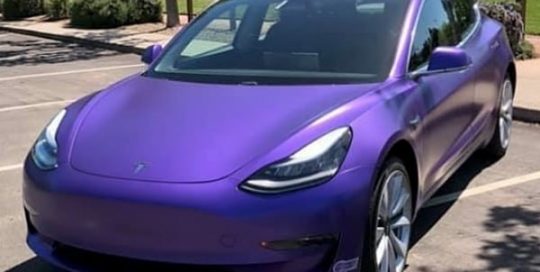 Tesla Model 3 wrapped in Avery Satin Purple Metallic vinyl