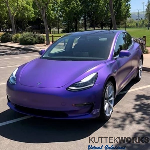 Tesla Model 3 wrapped in Avery Satin Purple Metallic vinyl