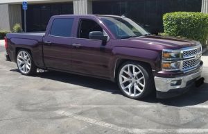 Chevrolet Silverado wrapped in Gloss Black Rose vinyl
