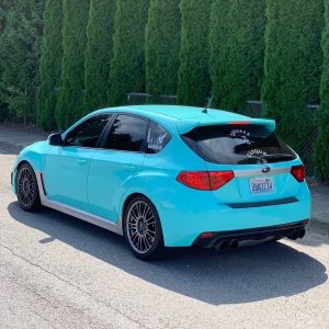 Subaru Outback wrapped in Gloss Mint Blue vinyl