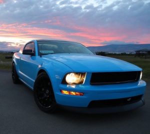 Ford Mustang wrapped in Gloss Light Blue vinyl