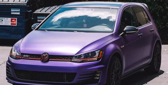 Volkswagen GTI wrapped in Avery Satin Purple Metallic vinyl