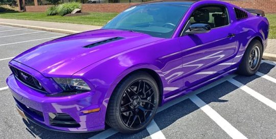 Ford Mustang wrapped in 3M 1080 Gloss Plum Explosion vinyl