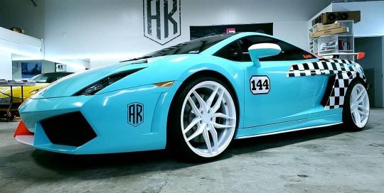 Lamborghini Huracan wrapped in Gloss Mint Blue, Gloss Black, and Satin White vinyl